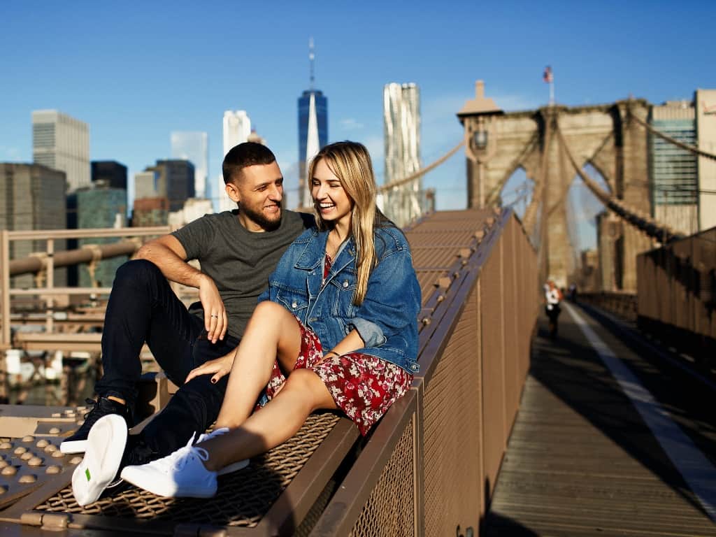 Couple on the Brooklyn Bridge in NYC
